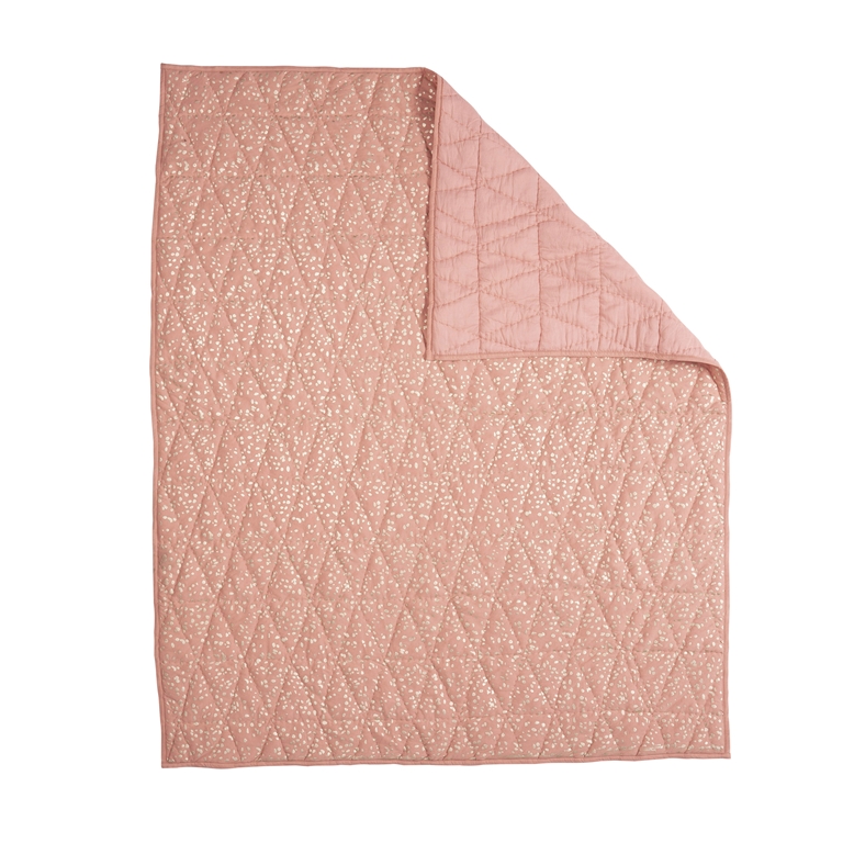 Couverture rose avec un motif de confettis dorés