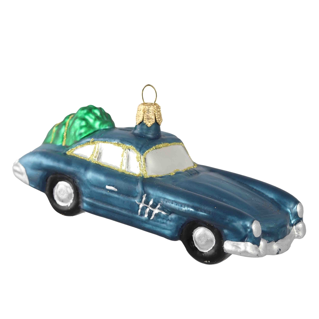 Voiture en verre bleue avec un sapin