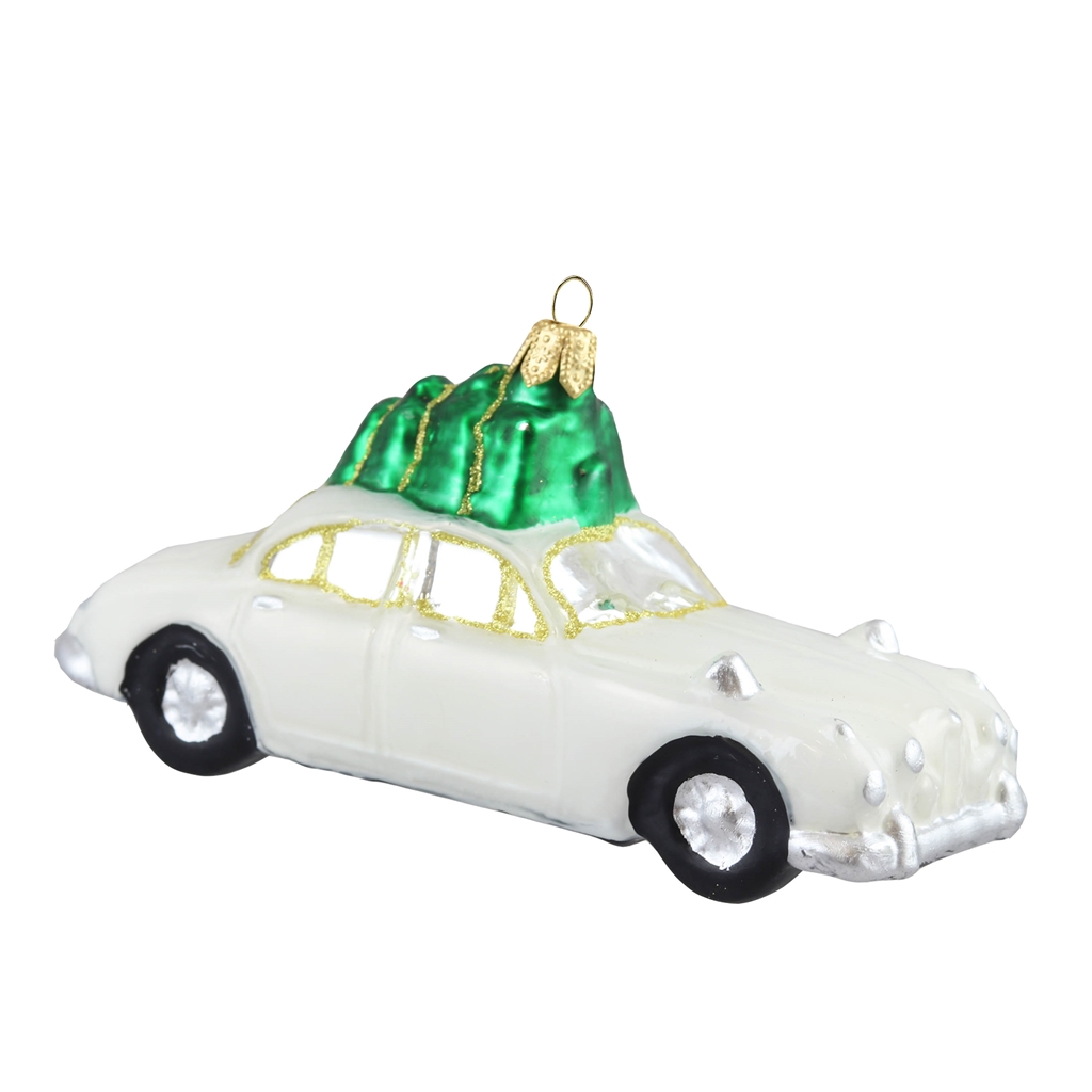 Voiture blanche avec un arbre de Noël