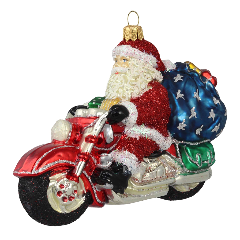Pere Noël sur une moto avec des cadeaux