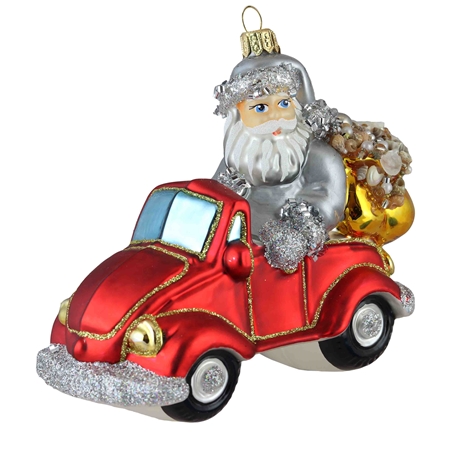 Pere Noël dans une voiture rouge