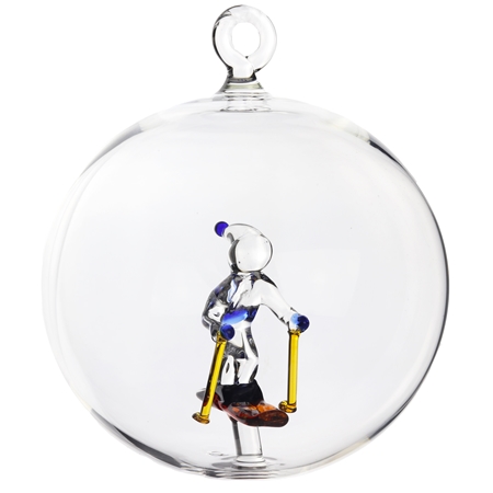 Boule en verre transparente, skieur