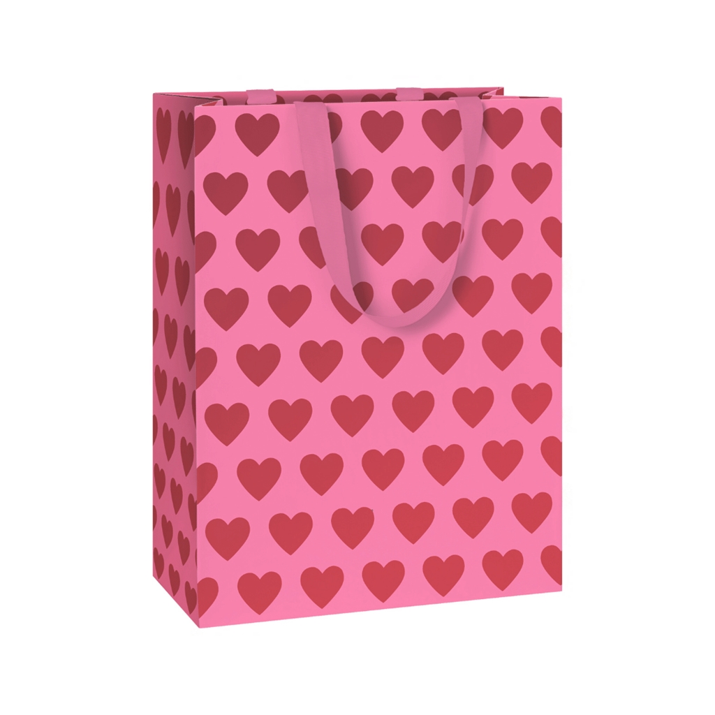 Sac cadeau rose avec des cœurs