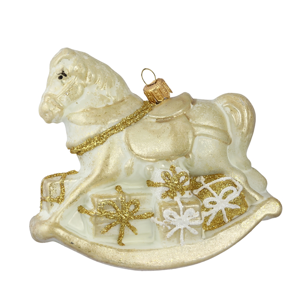 Cheval à bascule avec des cadeaux dorés