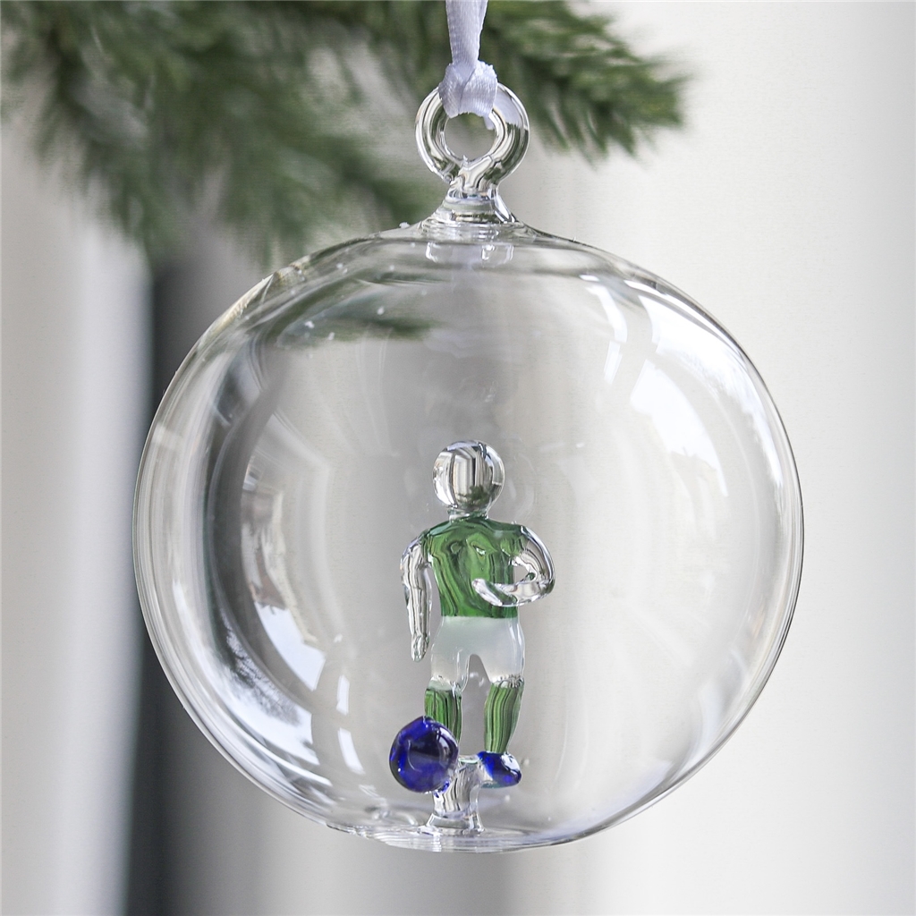 Boule en verre transparente, joueur de football