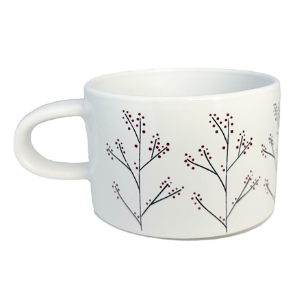 Mug blanc avec décoration en houx