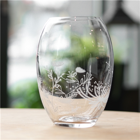 Vase rond transparent avec décoration florale