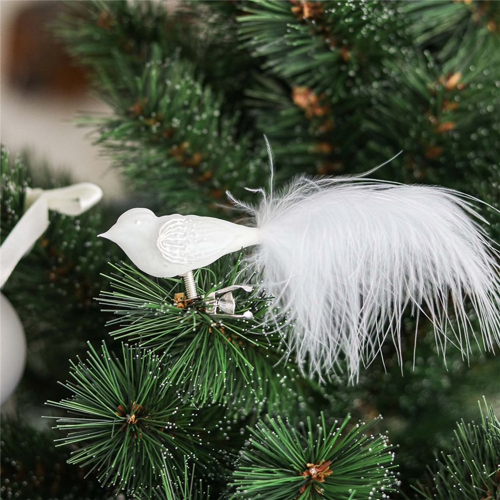 Oiseau en verre blanc avec décoration florale