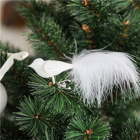 Oiseau en verre blanc avec décoration florale