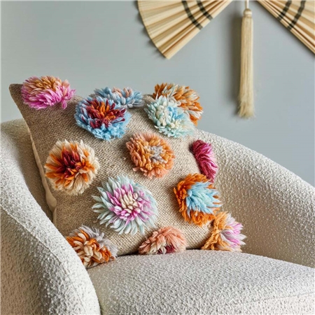 Oreiller avec fleurs en laine