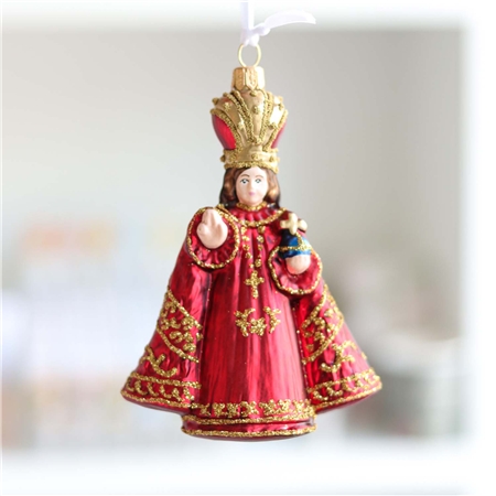 L'enfant Jésus en robe rouge