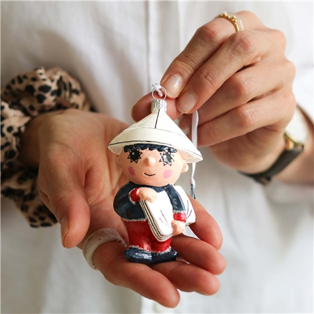 Figurine étoile du soir avec journal