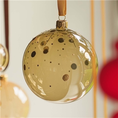 Ornement en verre transparent de couleur vert olive avec décor à pois dorés